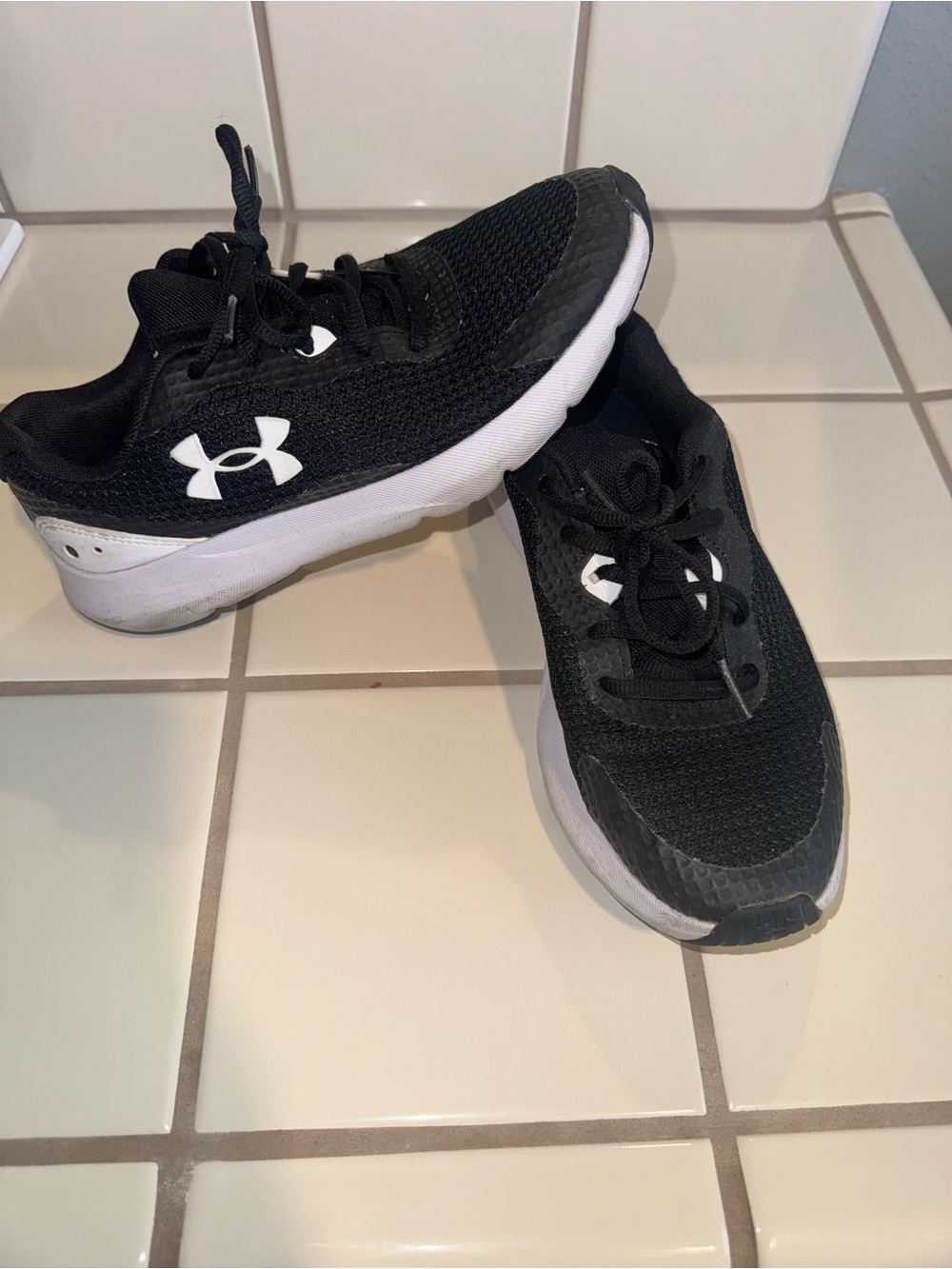 Under Armour women’s Black and White Lace-Up Sneakers